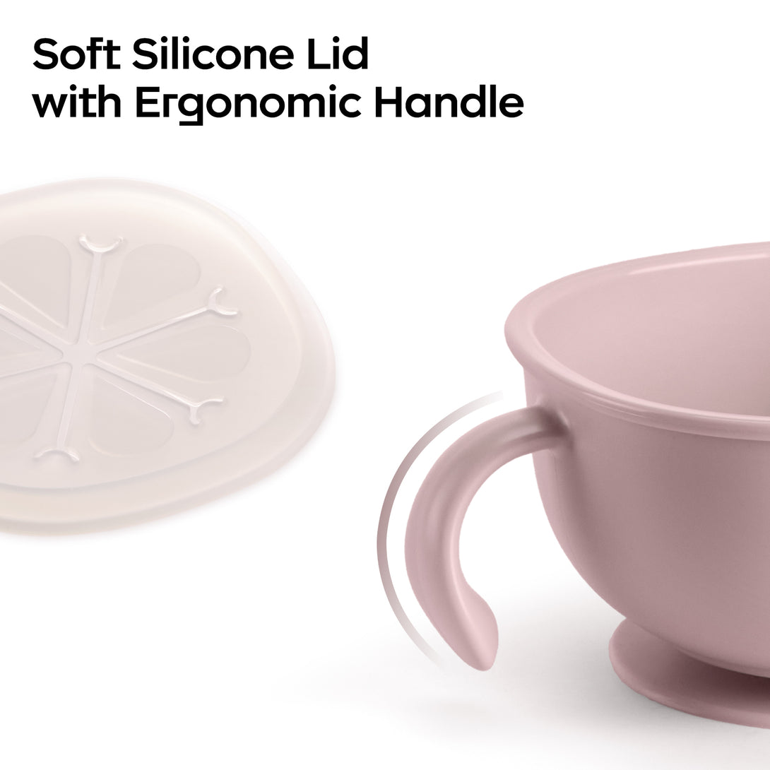  A pink snack bowl with ergonomic handle and soft silicone lid