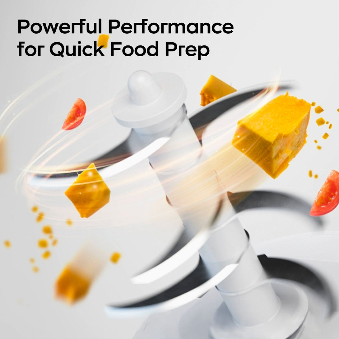 This image shows a baby food processor in operation. At the top, the text “Powerful Performance for Quick Food Prep” is displayed. The processor’s blades spin rapidly, surrounded by food pieces like tomato and yellow blocks, highlighting its efficient food - preparation ability.
