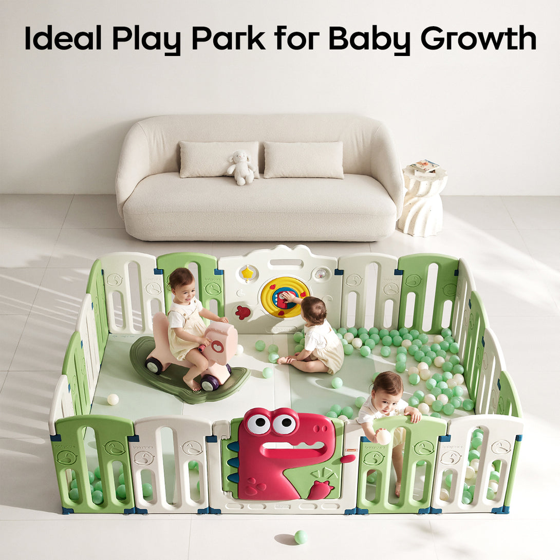 Three children playing in an indoor playpen with a sofa in the background