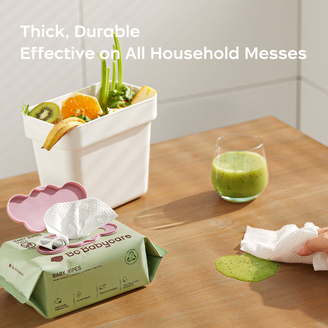 BC BabyCare thick wipes absorbing orange juice spills on a kitchen counter 