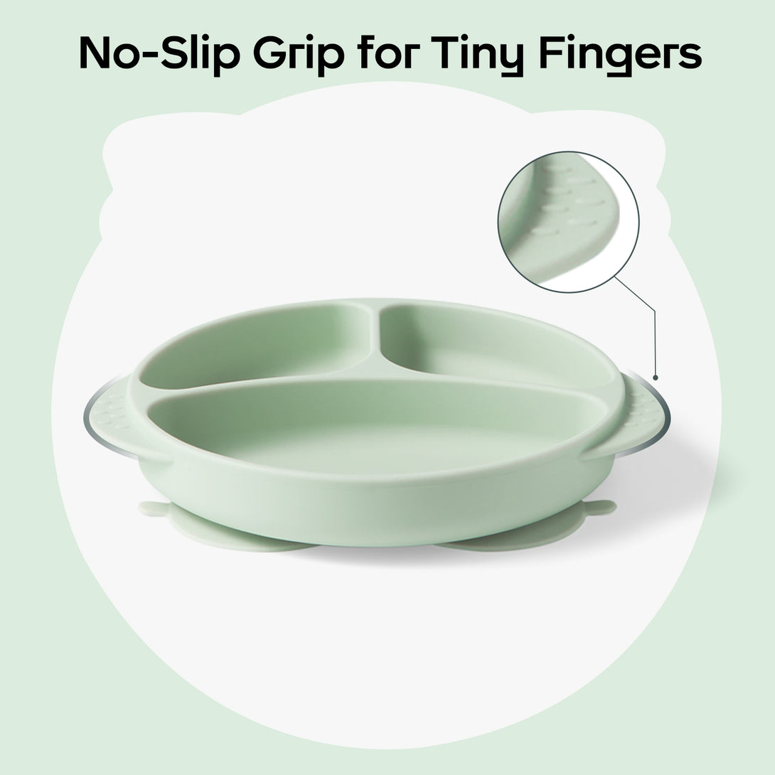 Close-up of silicone plate handle with textured grip (wavy ridges) for toddlers. Text overlay: 'No-Slip Grip for Tiny Fingers' at top. 