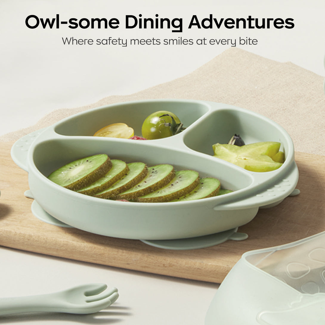 Owl-shaped silicone plate filled with fruits.