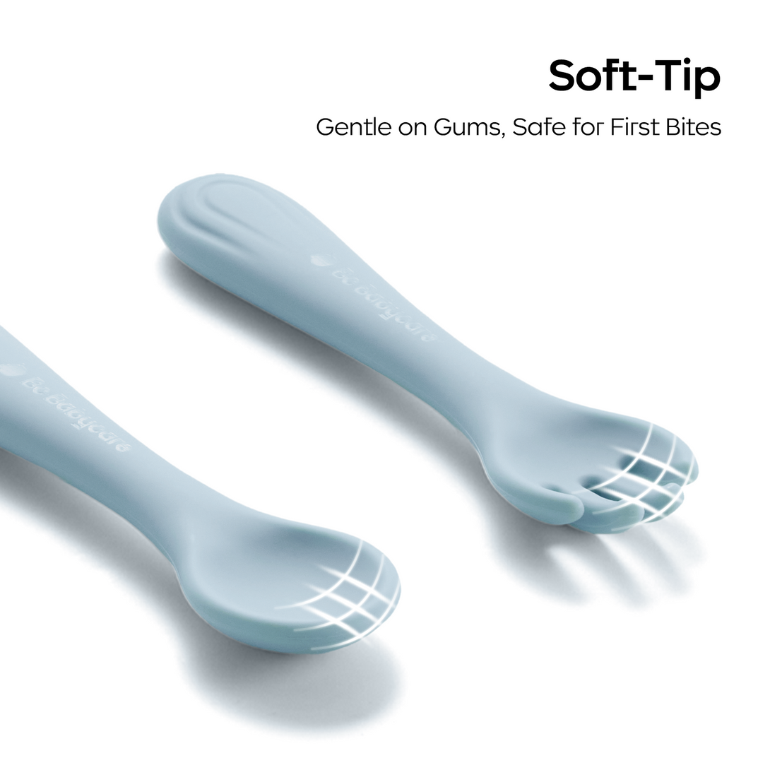 Front detail view of a blue silicone fork and spoon set.