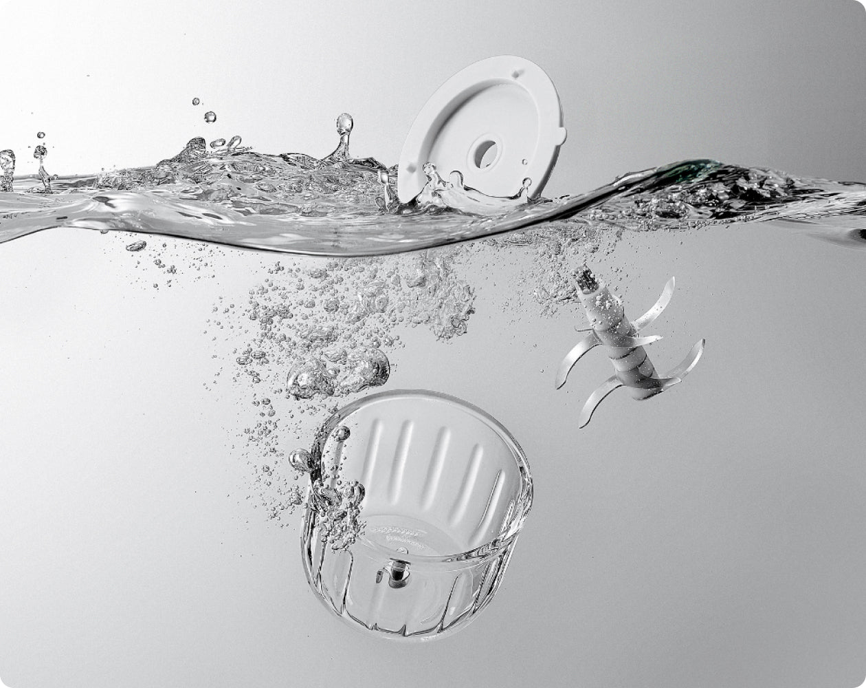 Detachable glass bowl, blade assembly, and inner cover shown separately for easier hand washing.