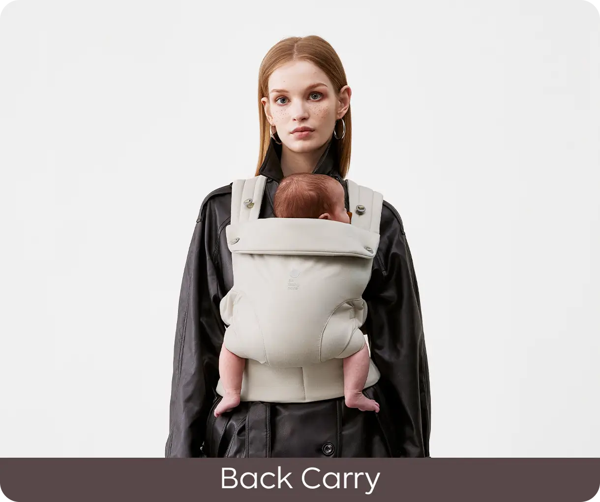 Parent demonstrating the CocoonGo Baby Carrier in a back carry position.