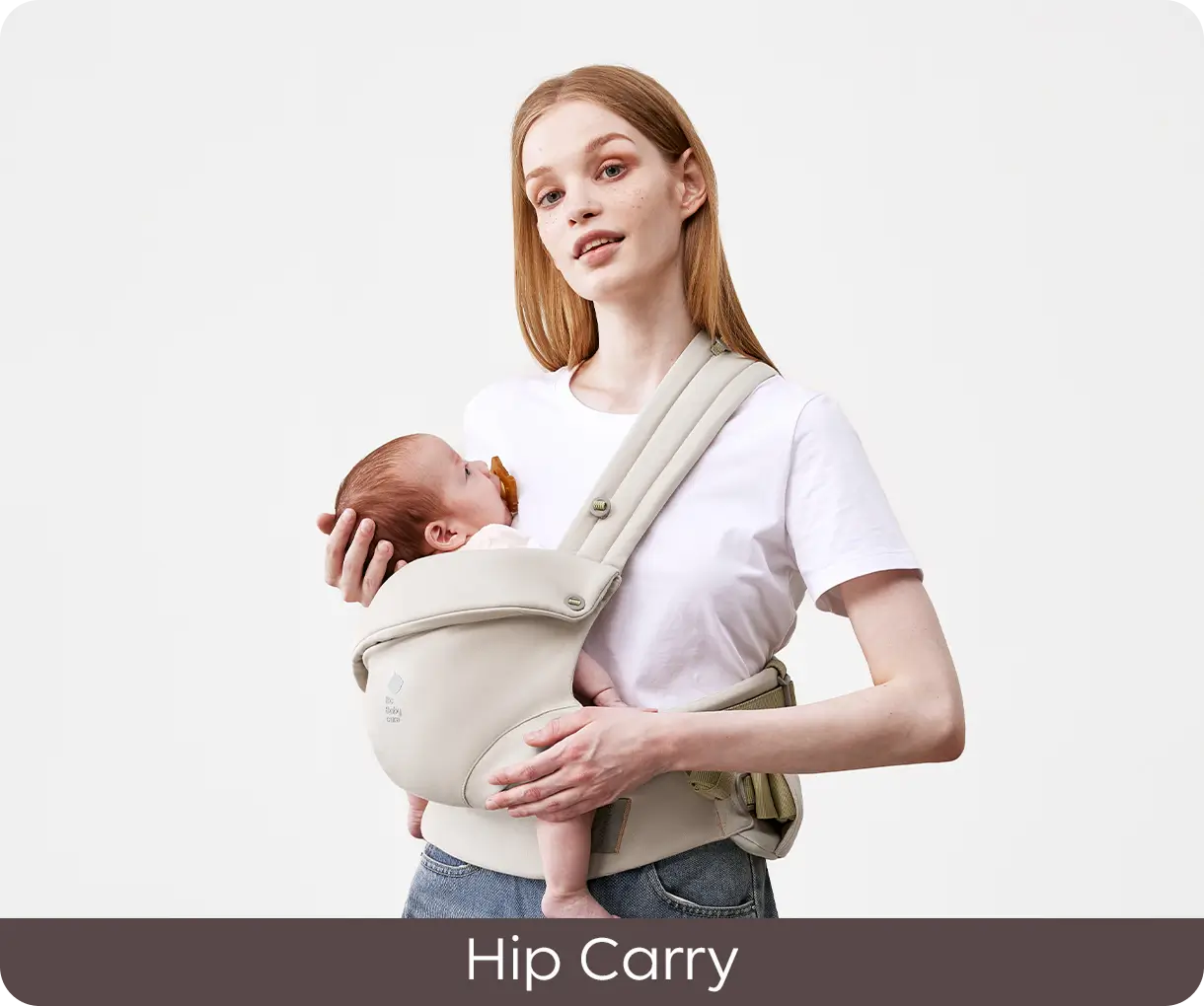 Parent demonstrating the CocoonGo Baby Carrier in a hip carry position.